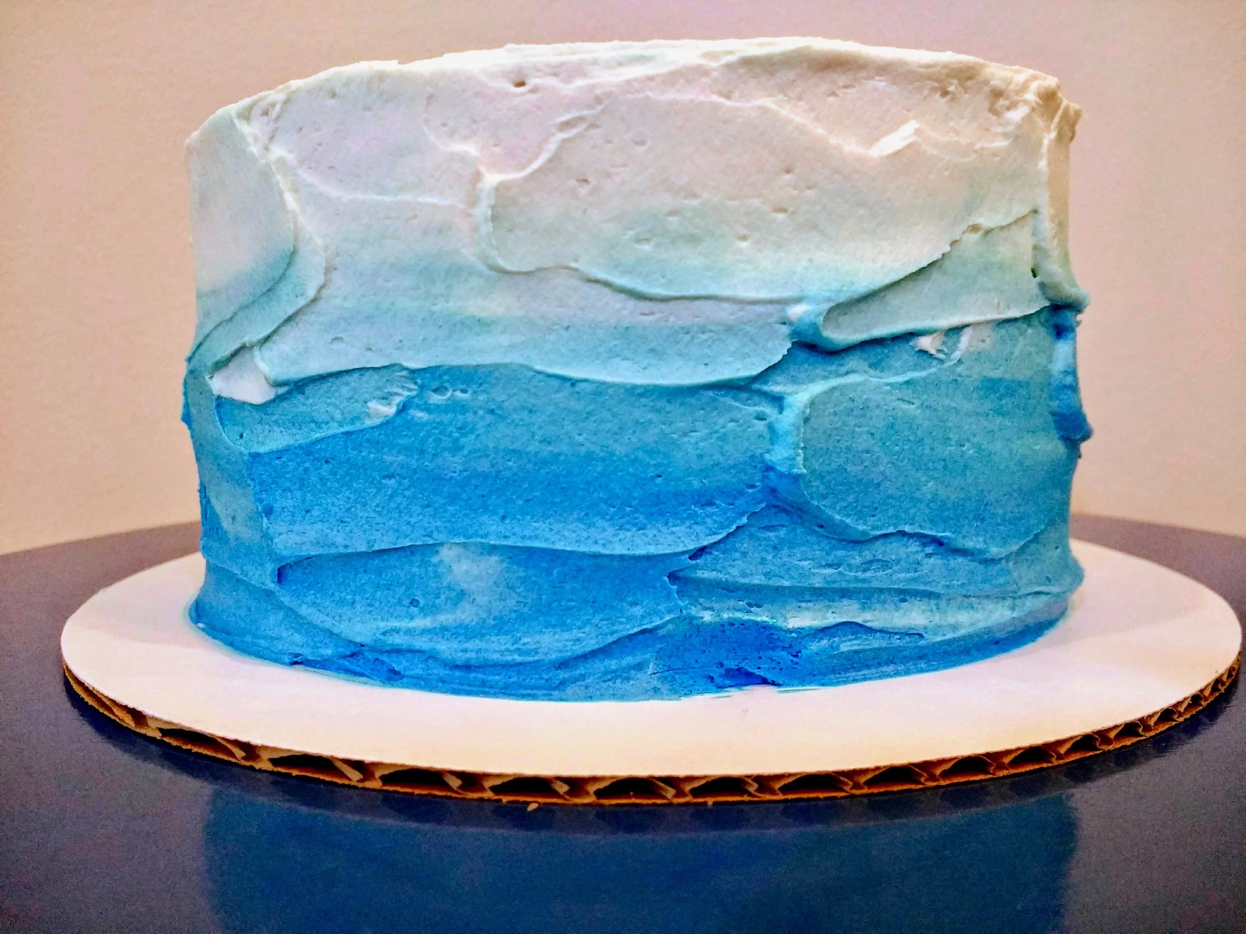 strawberry-filled Coconut Cake with blue ombre frosting — Beneath the Crust