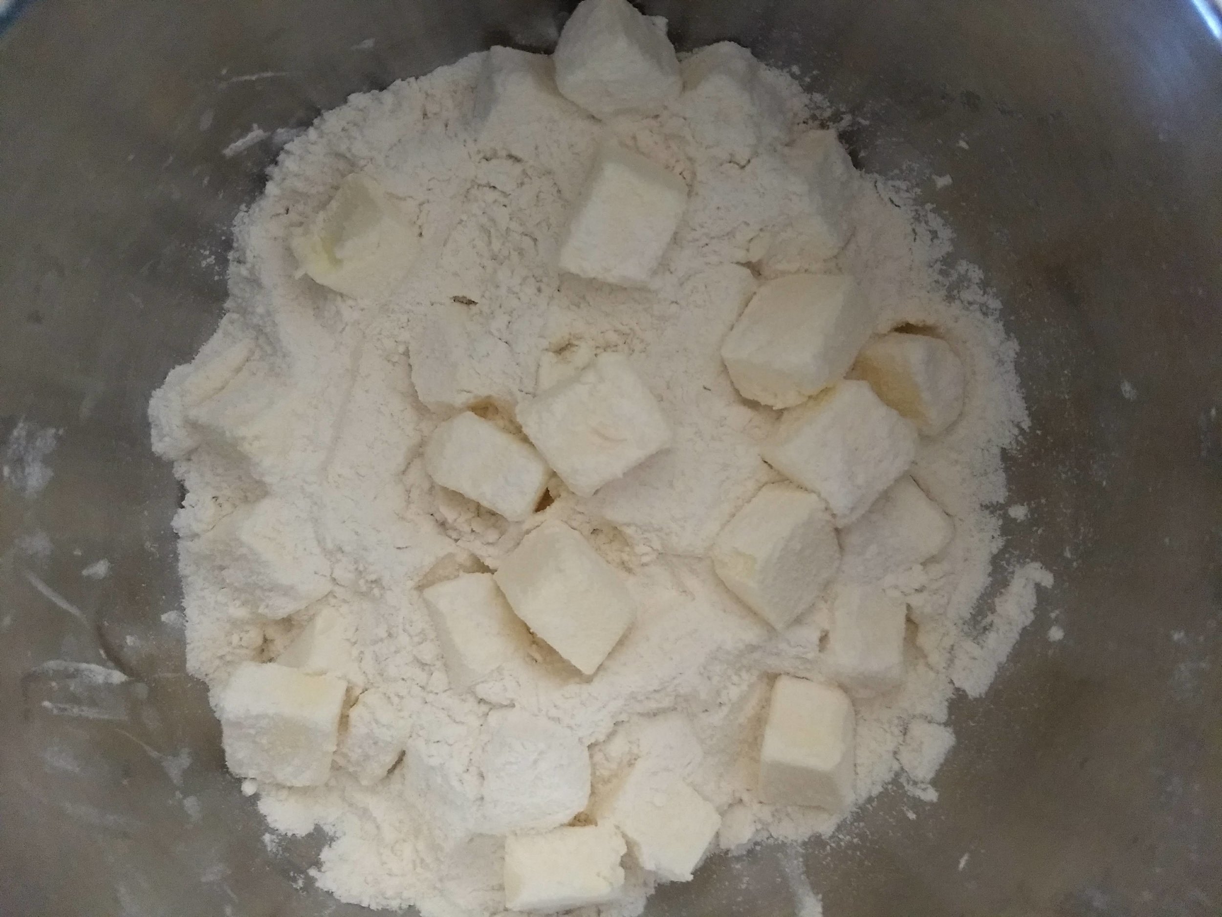 Cubed butter lightly tossed with flour mixture