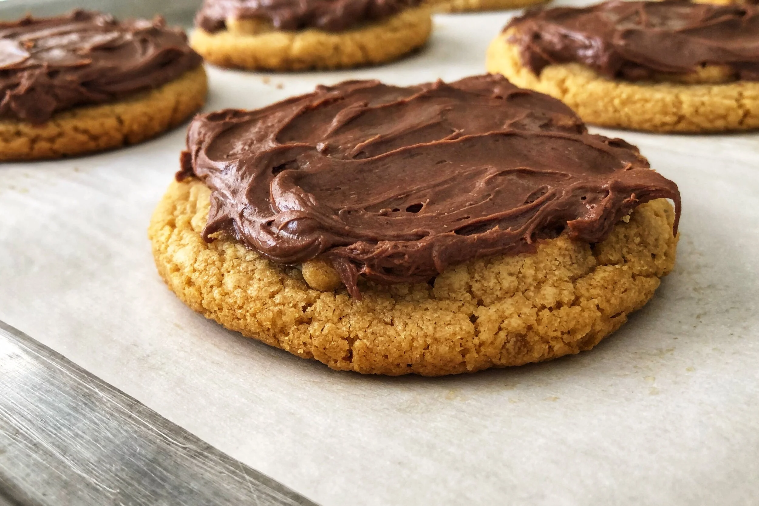 Fudge frosted bakerystyle big & soft peanut butter cookies — Beneath