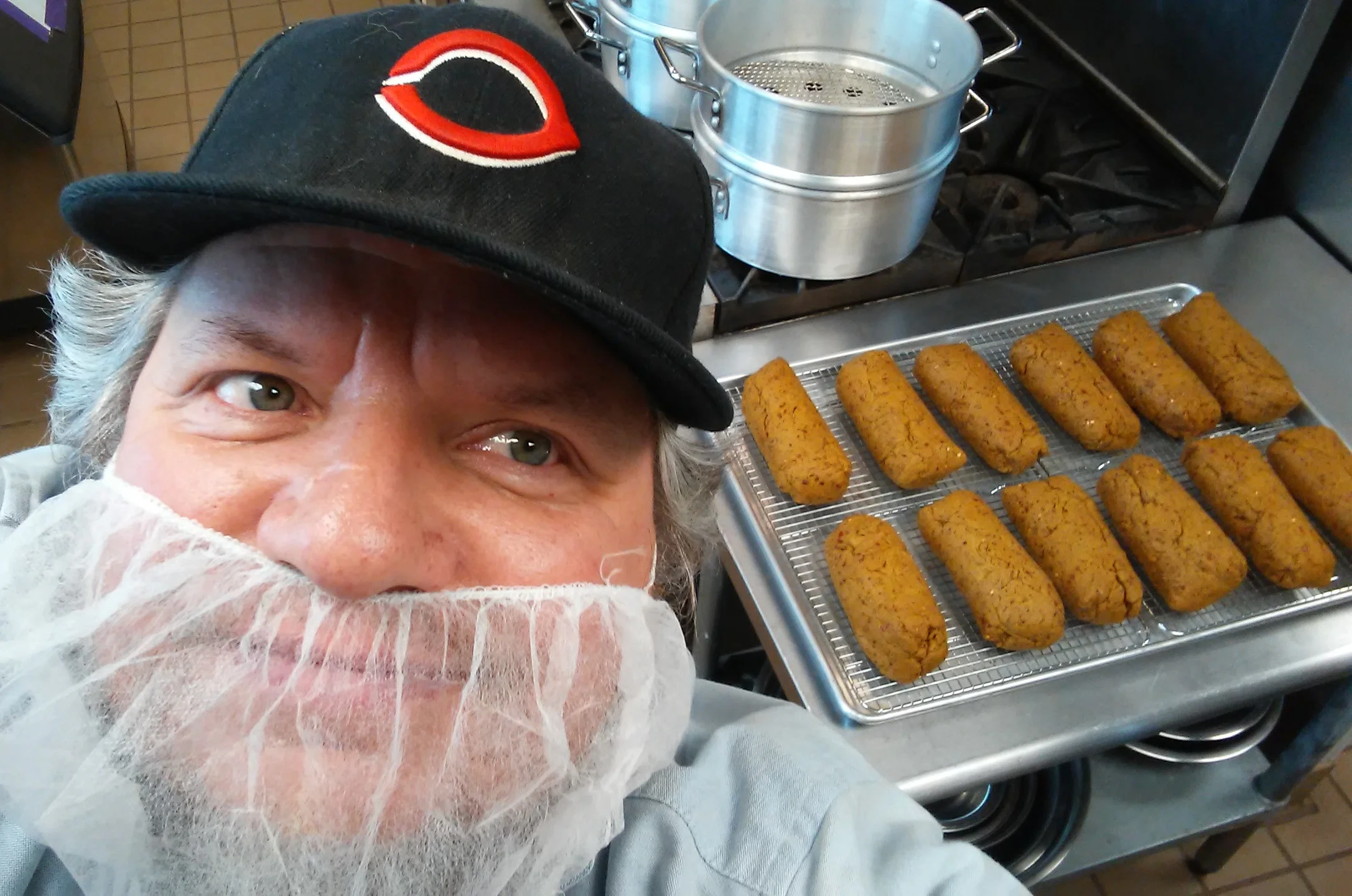 Shane in the kitchen with a fresh batch of Bangers.