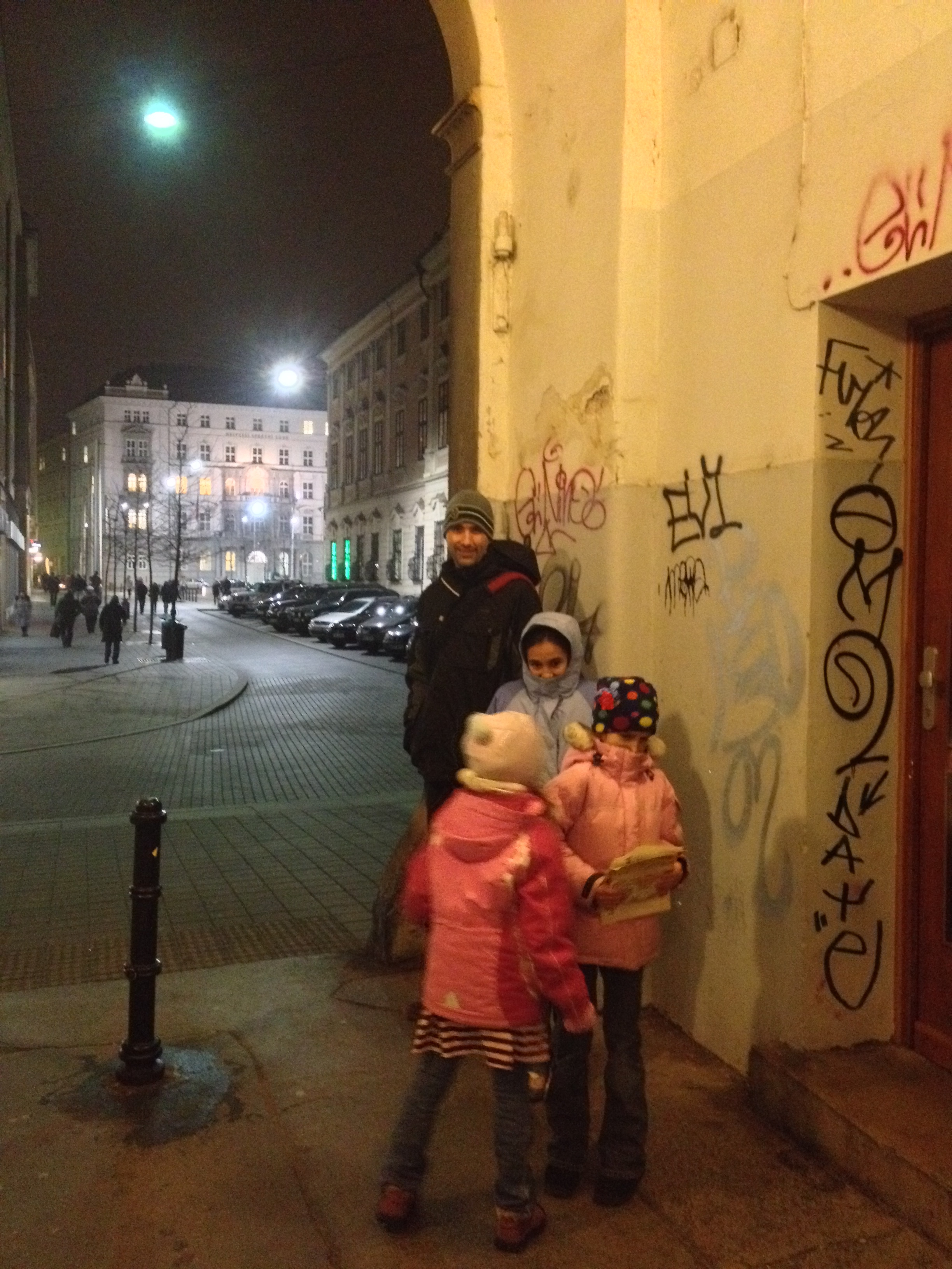 We walk through this graffiti-filled tunnel that goes through the beautiful building above. Can you tell it's chilly? 