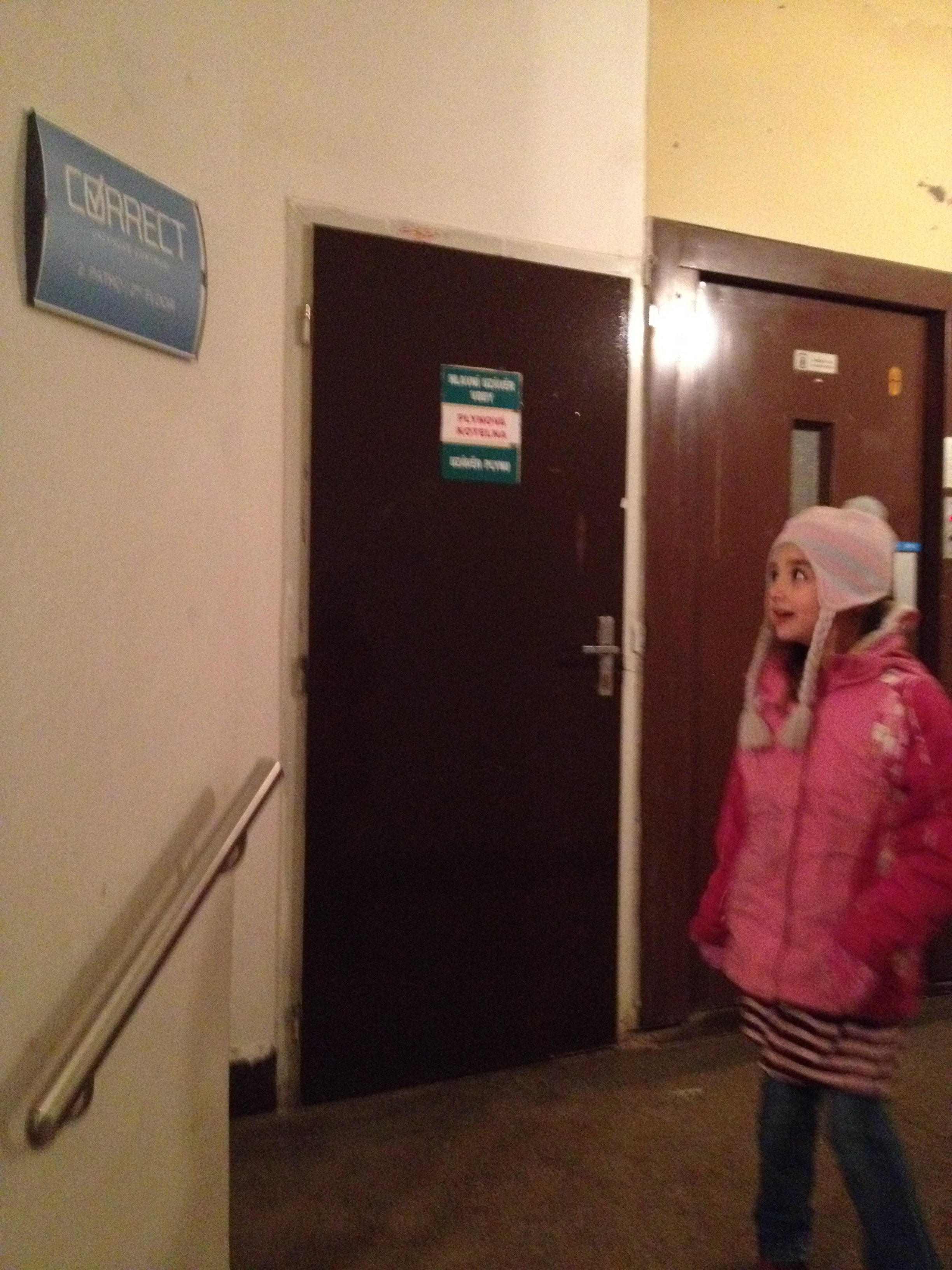 Our school is called "Correct" and is located in a typical, old and, well, fairly dingy building in the square. Here Hannah is glancing at the sign.