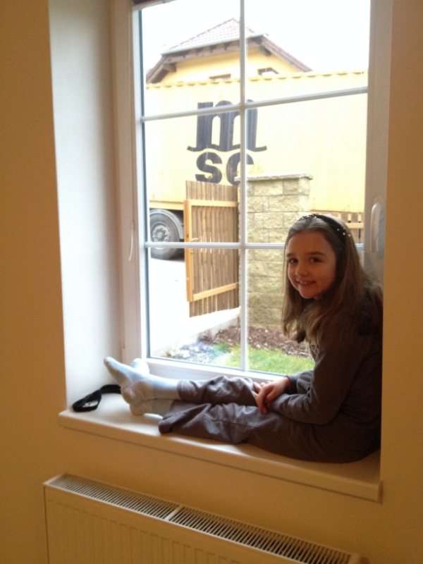 Hannah is watching them unload from inside--too cold out there! 