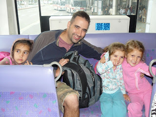 In this shot the girls are 6, 4, and 2. I couldn't find an older one because our big computer and photo files are sailing across the Atlantic right now (hopefully, please, God). 