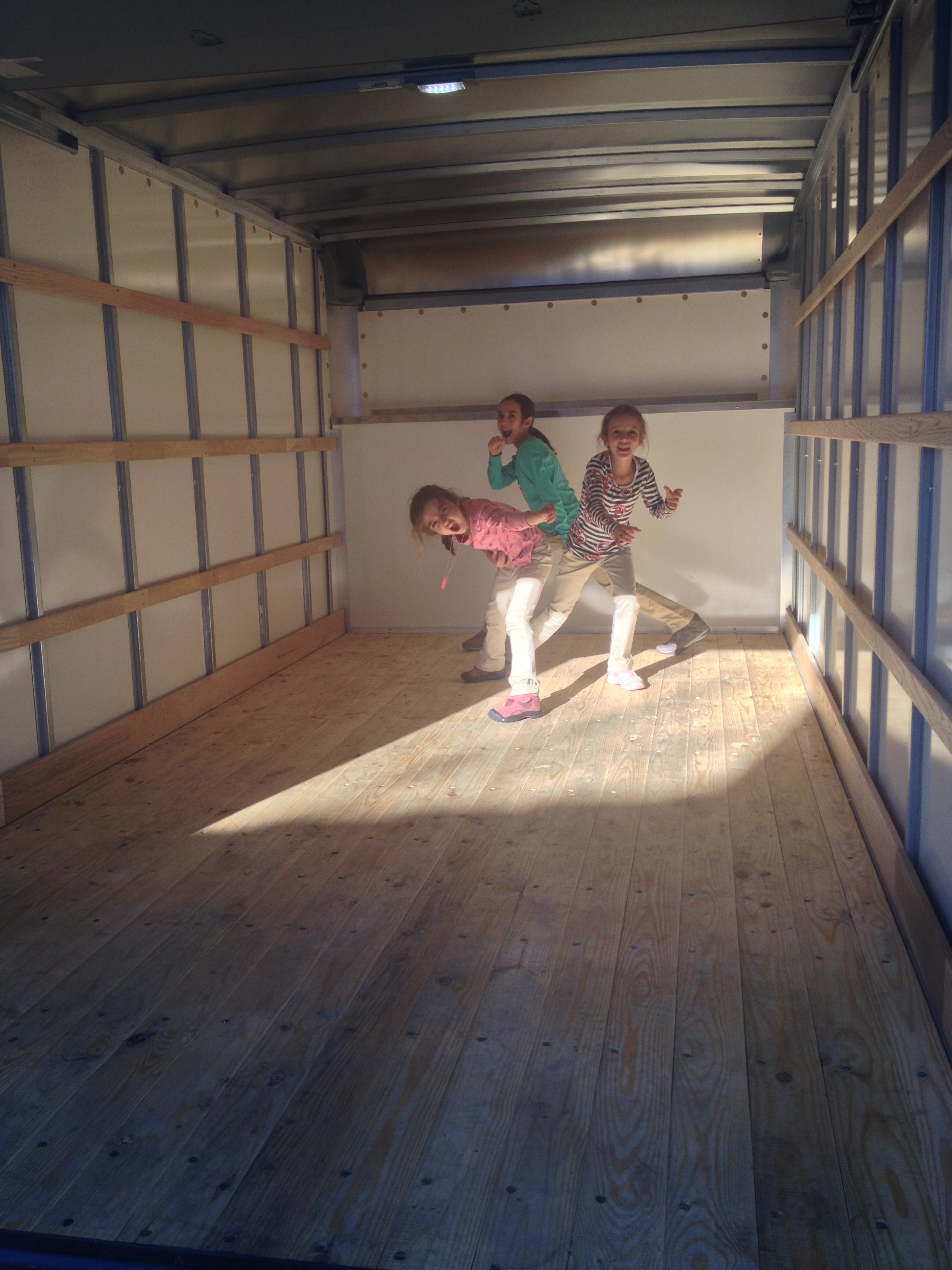 We rented a truck to get all our stuff from my in-laws' house to a warehouse. The girls mistook it for a rock-star stage. 