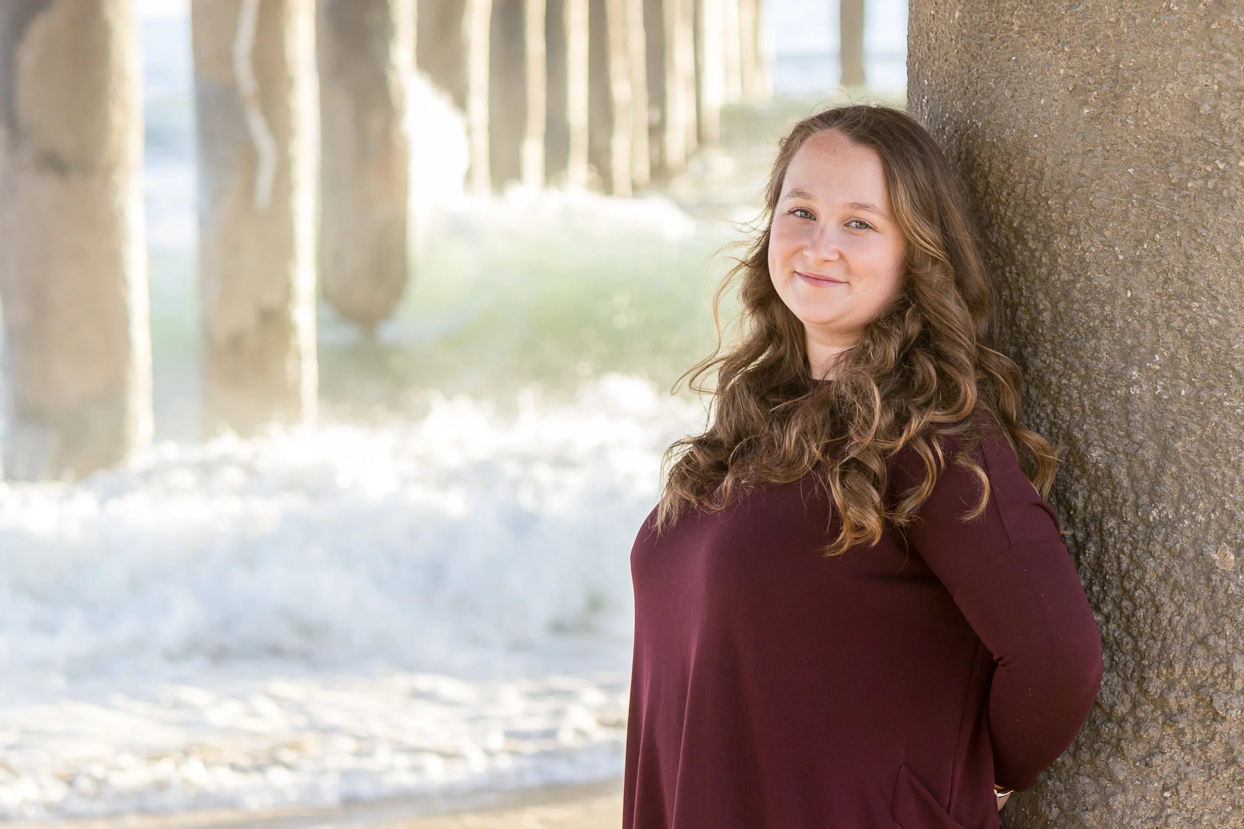 Senior Girl leaning on the Hermosa Beach Pier