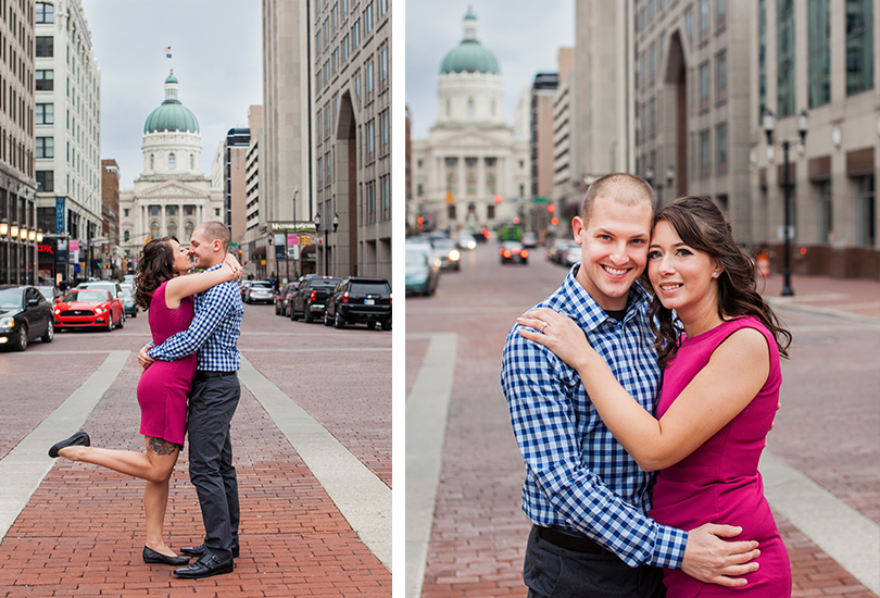 Downtown-Indianapolis-engagement-portrait-photographer-couple-on-monument-circle-state-house-street-kiss.jpg