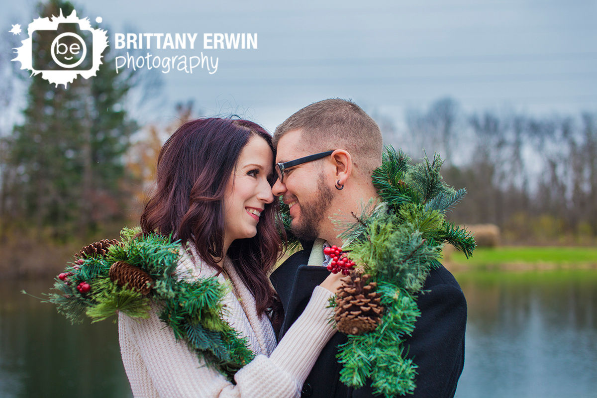 Christmas-elopement-wedding-photographer-couple-snuggle-outdoor-cold-garland.jpg