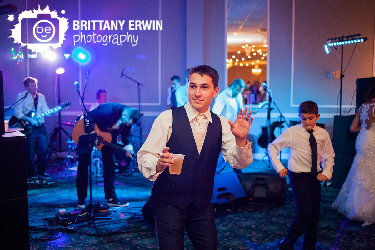 Indianapolis-wedding-photographer-groom-beer-on-dance-floor-the-palms.jpg