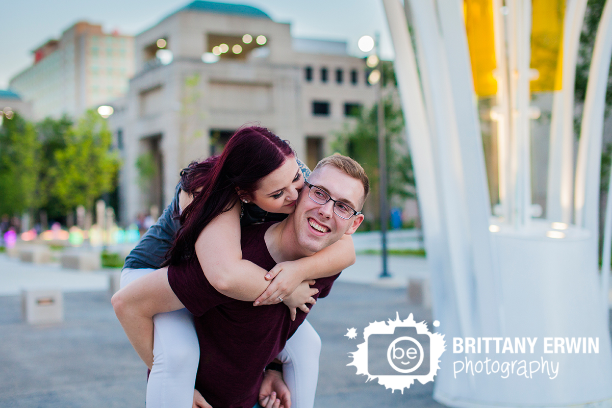 Downtown-Indianapolis-engagement-portrait-photographer-piggy-back-ride-fun-session.jpg