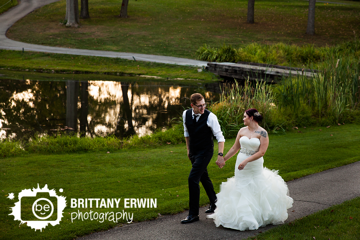 Indianapolis-wedding-photographer-couple-walking-by-pond-Hillcrest-Country-Club-sunset-portrait.jpg