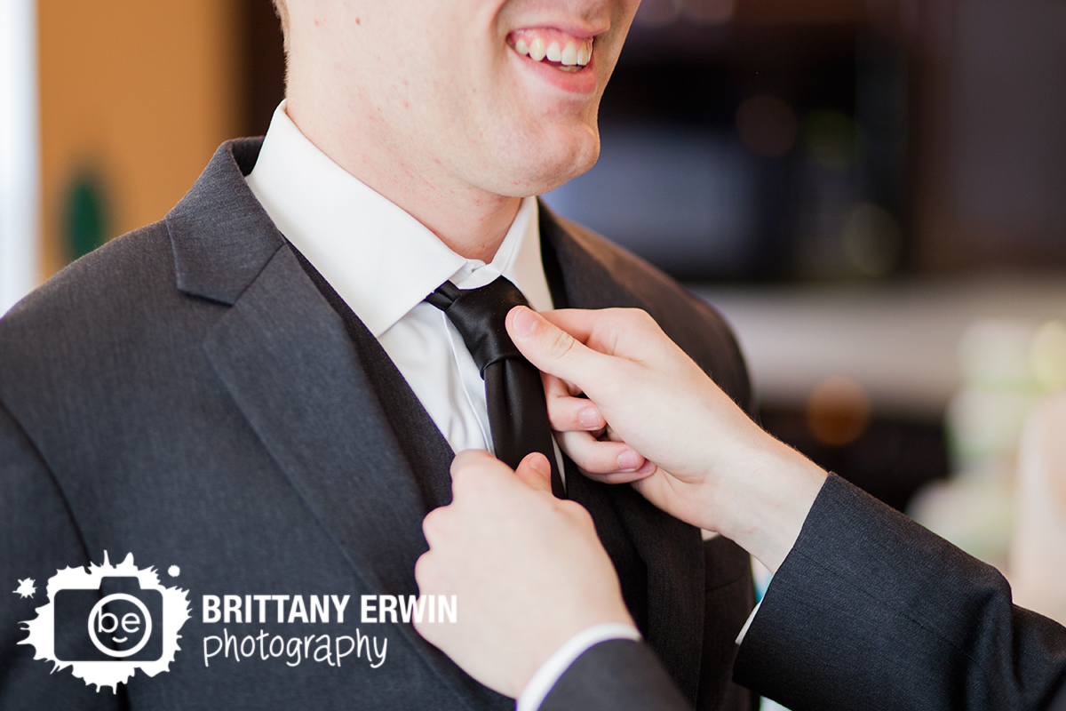 Indianapolis-wedding-photographer-groom-adjust-tie-getting-ready.jpg