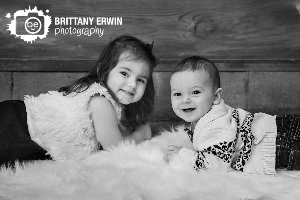 Studio-portrait-photographer-brother-sister-fur-rug-christmas-portrait.jpg