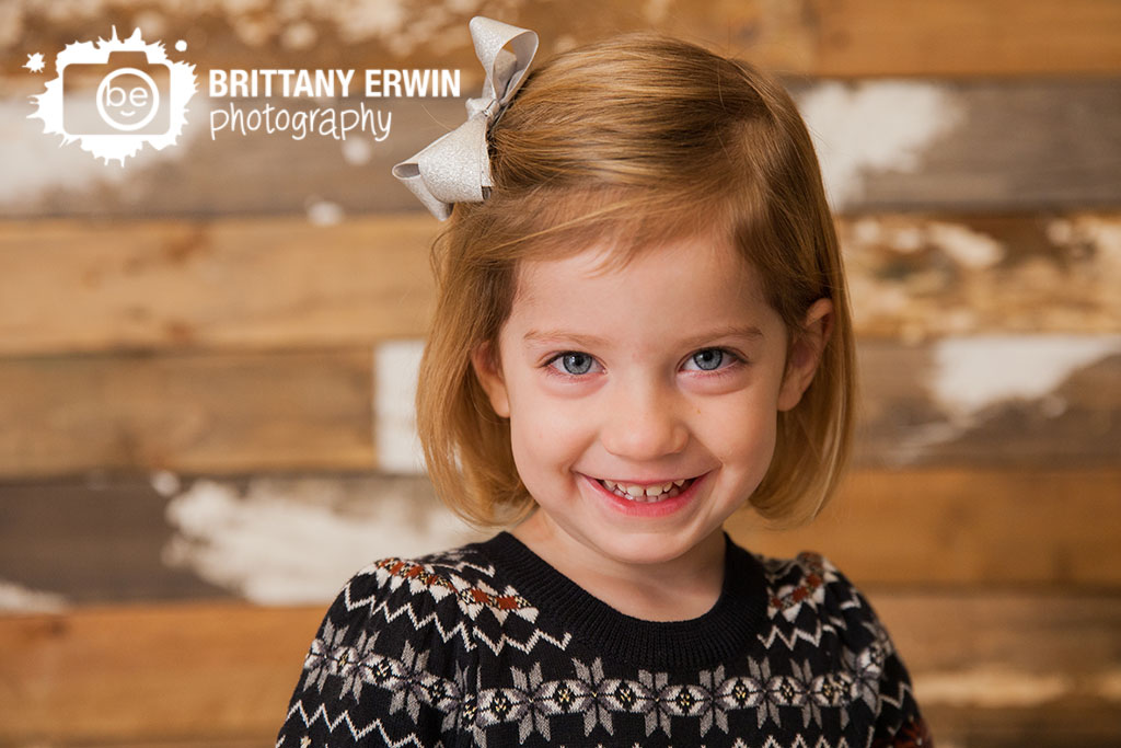 Speedway-Indiana-portrait-studio-photographer-girl-christmas-dress-rustic-barn-wood-wall.jpg