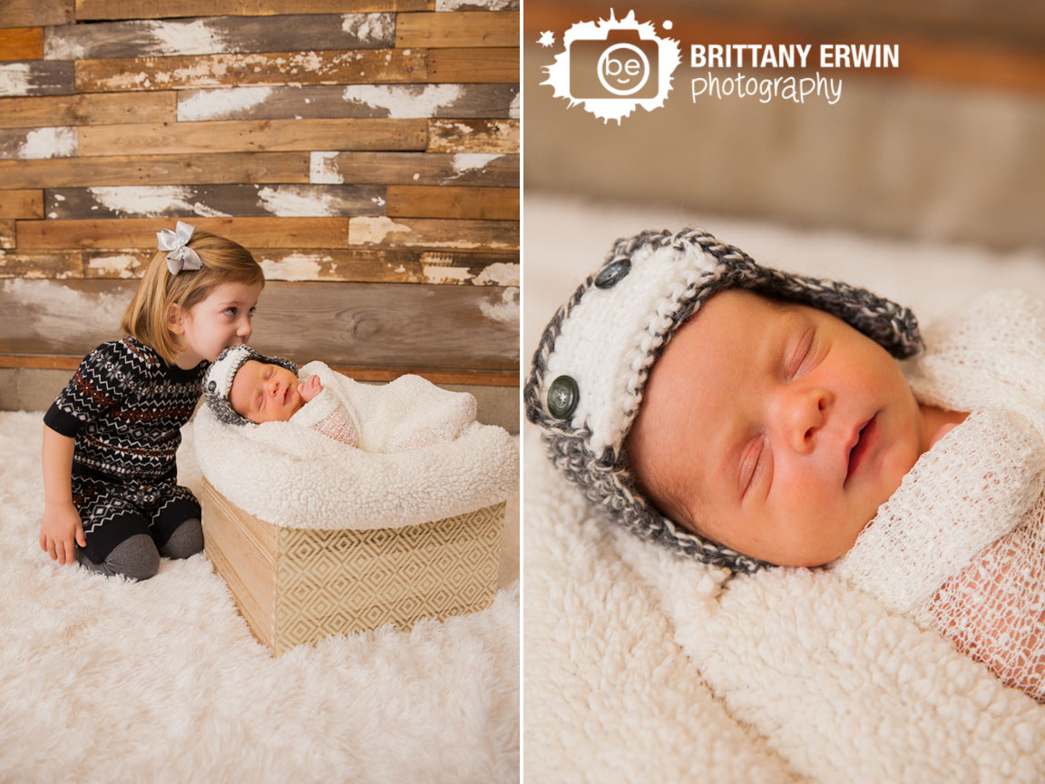 Speedway-Indiana-newborn-studio-photographer-sister-with-baby-brother-kiss-crochet-hat.jpg