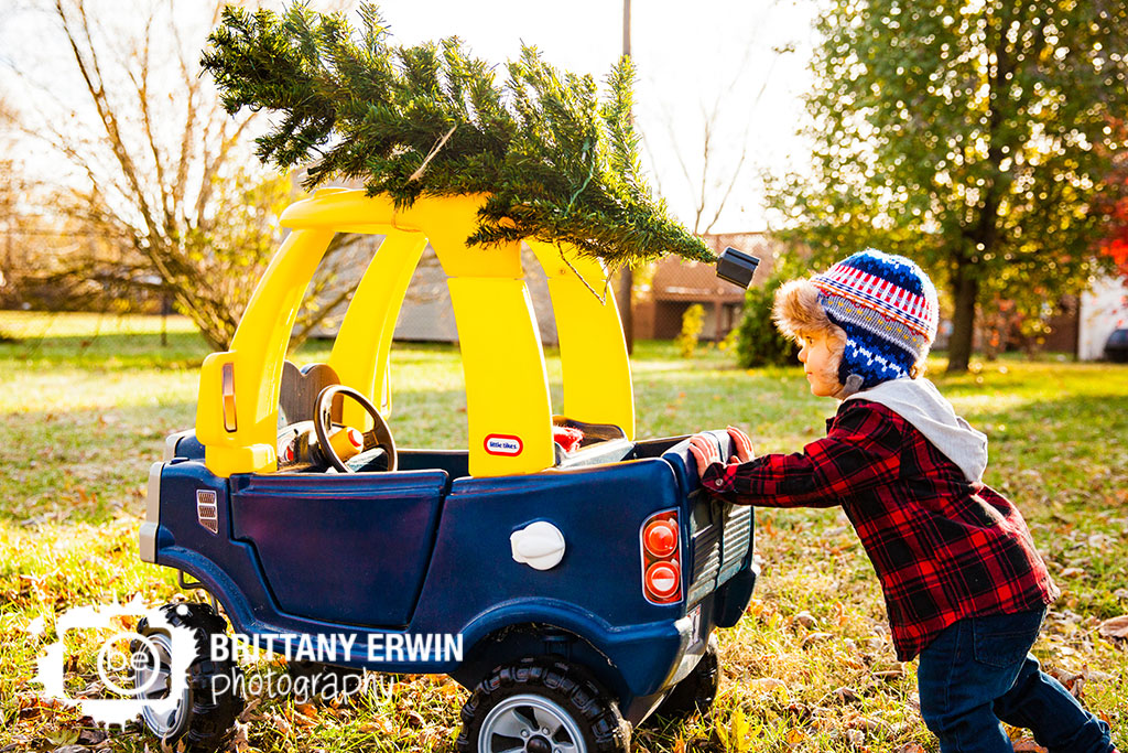 Speedway-christmas-card-photographer-toddler-push-toy-truck-tree-tied-to-top.jpg