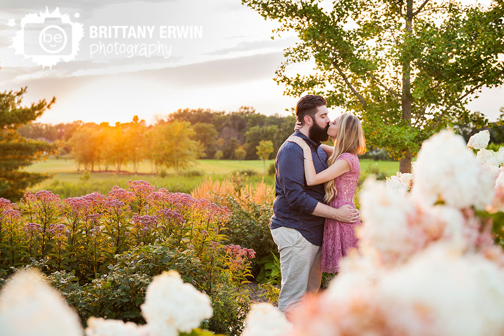 Coxhall-Gardens-Carmel-engagement-portrait-photographer-spring-flower-garden-couple-kiss-sunset.jpg