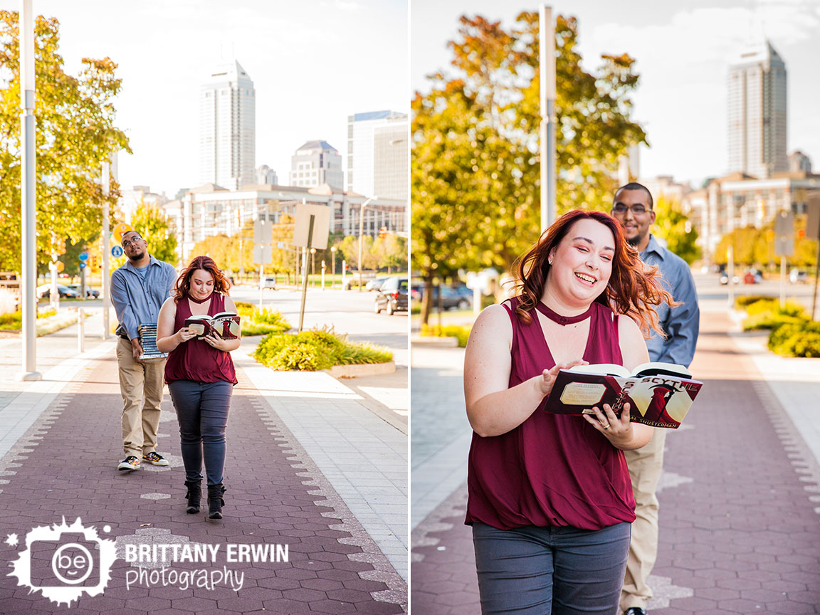 Fountain-Square-Indiana-engagement-portrait-photographer-funny-book-stack-couple-walking-downtown-skyline.jpg