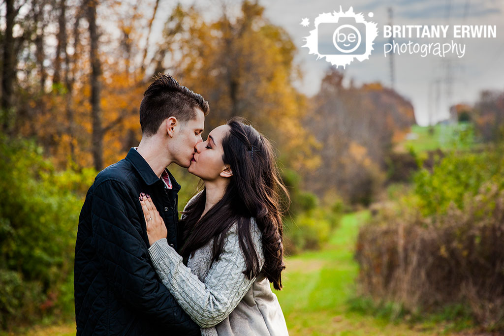 Indianapolis-fall-engagement-portrait-photographer-couple-kiss-trees.jpg