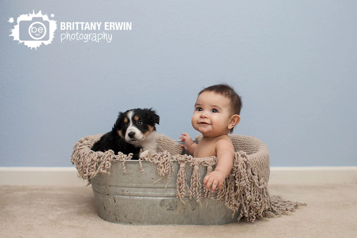 Indianapolis-at-home-lifestyle-portrait-photographer-baby-boy-with-puppy-in-wash-basin.jpg