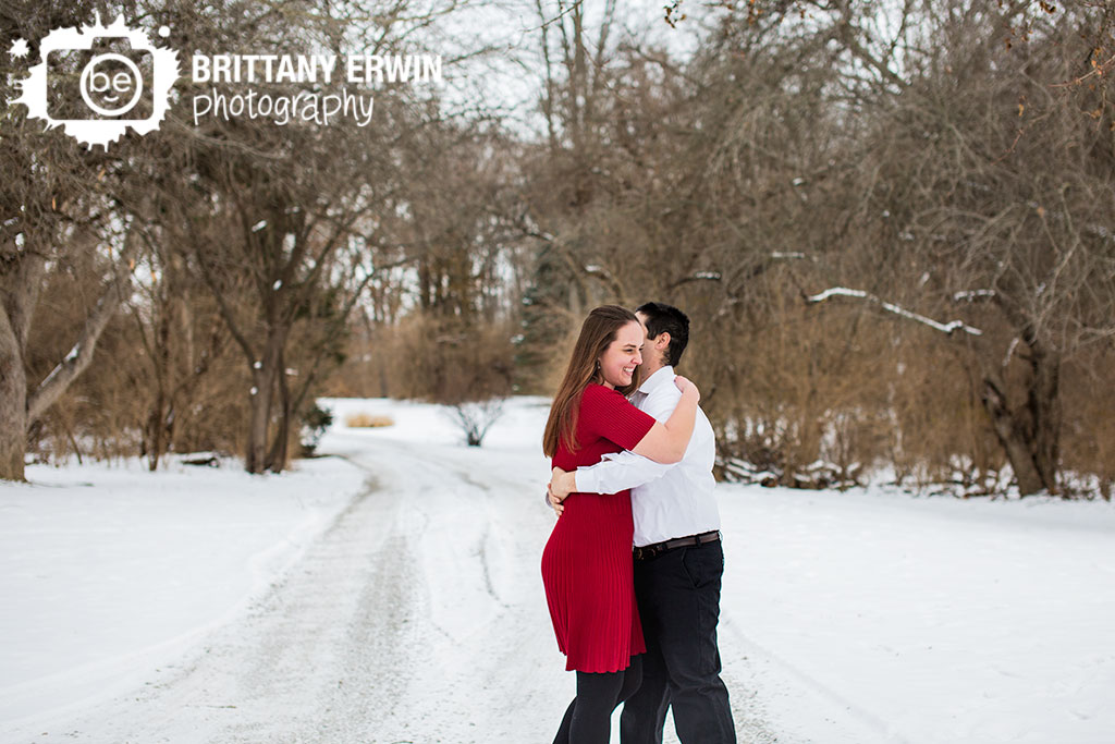 Indianapolis-couple-outdoor-winter-engagement-session-dancing-fun-in-snow.jpg