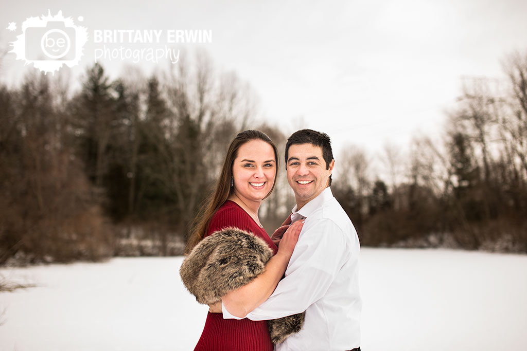 Indianapolis-engagement-portrait-photographer-outdoor-winter-couple-on-dock-near-pond.jpg