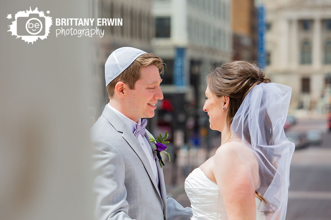 Downtown-Indianapolis-first-look-wedding-photographer-couple-on-monument-circle-purple-boutonniere.jpg