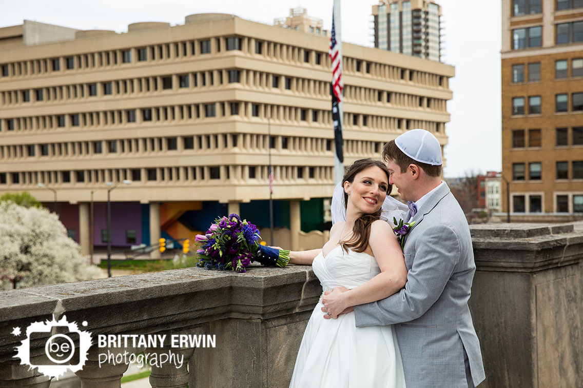 Downtown-Indianapolis-skyline-portrait-wedding-photographer-violets-are-blue-bouquet-couple.jpg