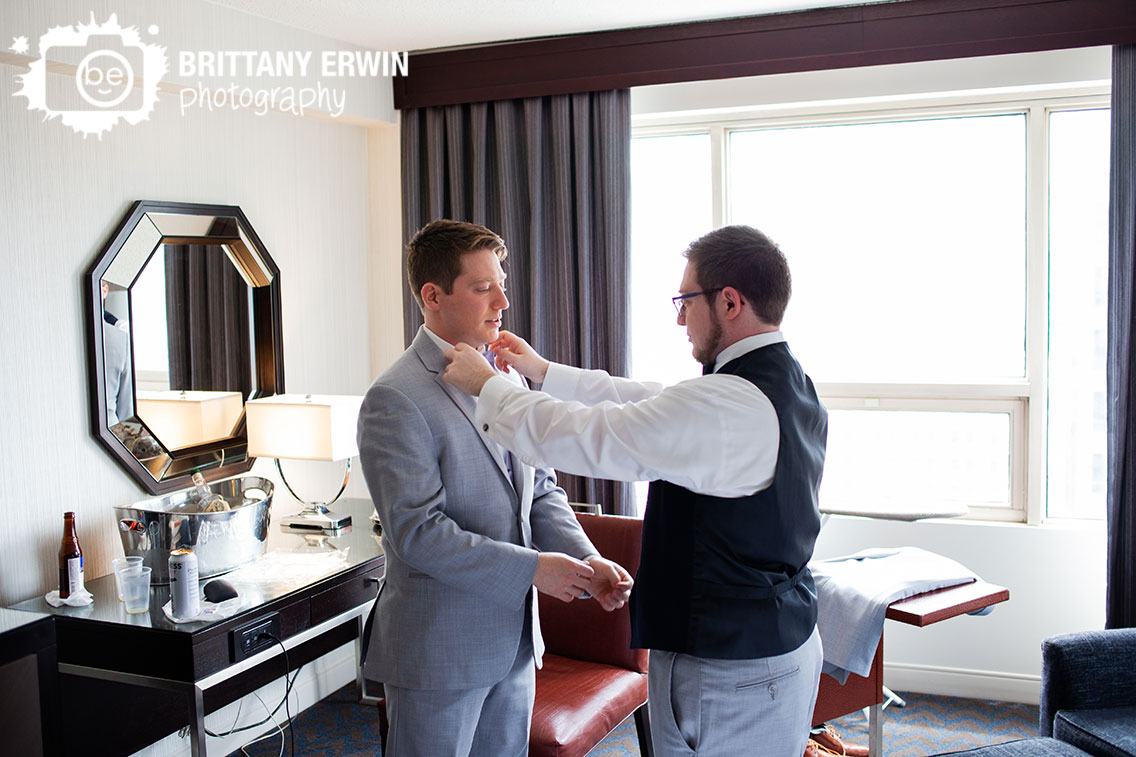 Downtown-Indianapolis-wedding-photographer-best-man-straighten-groom-bow-tie.jpg