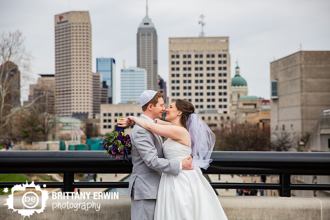 Downtown-Indianapolis-wedding-photographer-skyline-portrait-couple-jerwish-ceremony-purple-bouquet.jpg