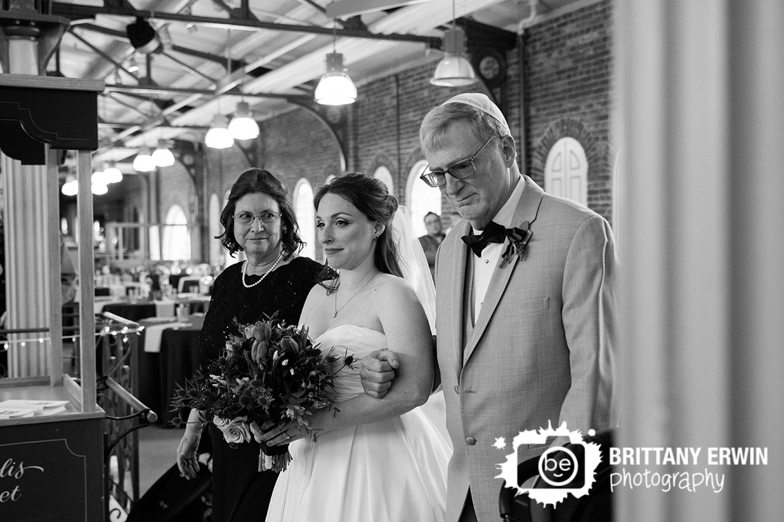 Downtown-Indianapolis-city-market-jewish-wedding-ceremony-photographer-bride-walking-down-aisle-with-parents.jpg