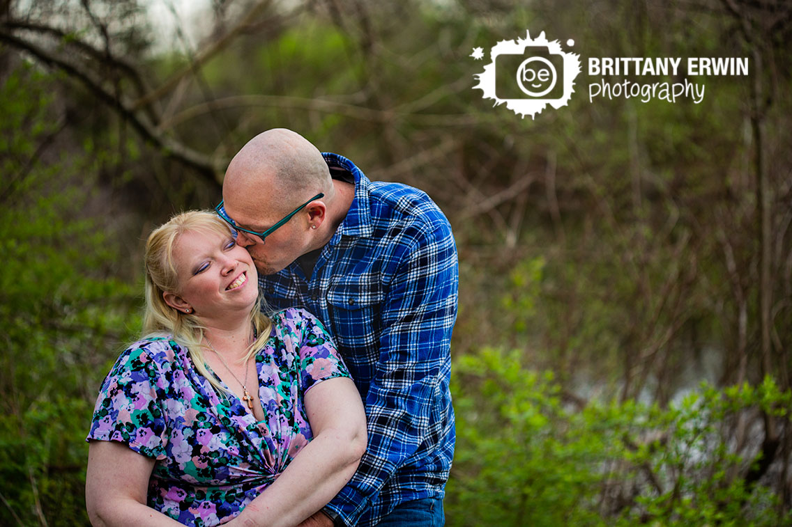 Camby-Indiana-engagement-portrait-photographer-cheek-kiss-couple-by-boat.jpg