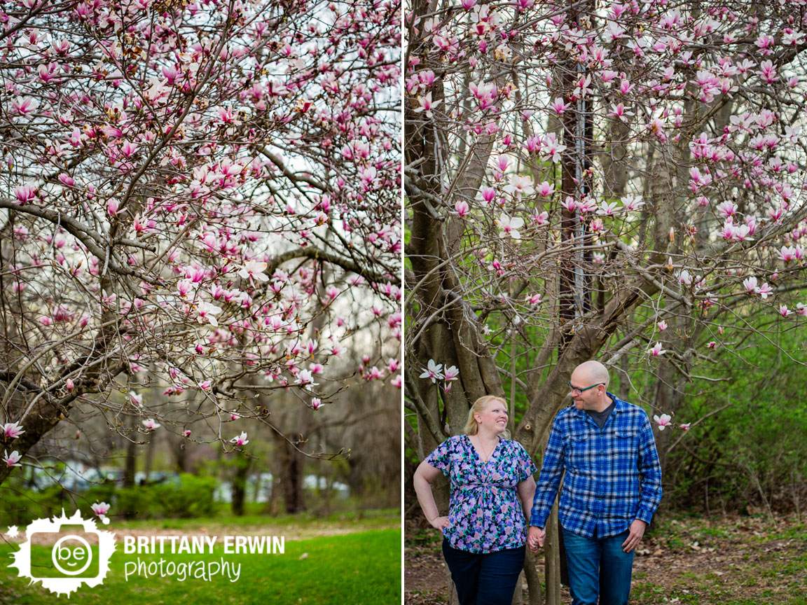 Spring-engagement-portrait-photographer-magnolia-tree-couple-walking.jpg
