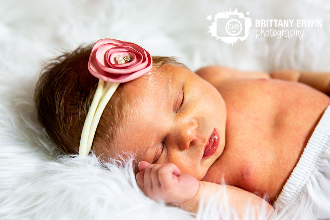 Lifestyle-newborn-portrait-photographer-fuzzy-rug-baby-girl-headband.jpg