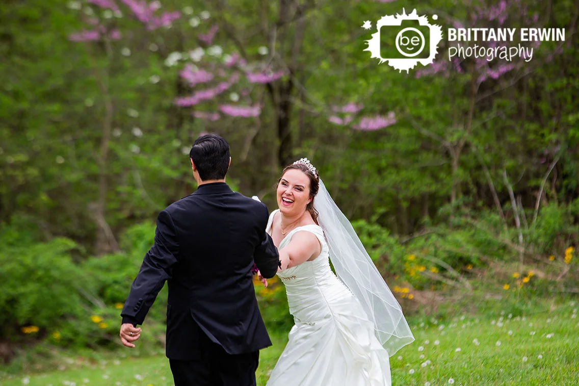 Clayshire-Castle-spring-wedding-photographer-couple-fun-in-field.jpg