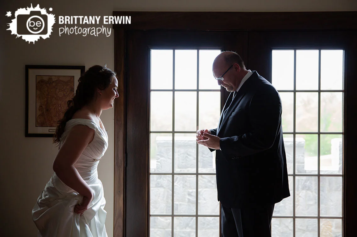 father-of-the-bride-giving-her-pennies-for-shoe-library-before-ceremony.jpg