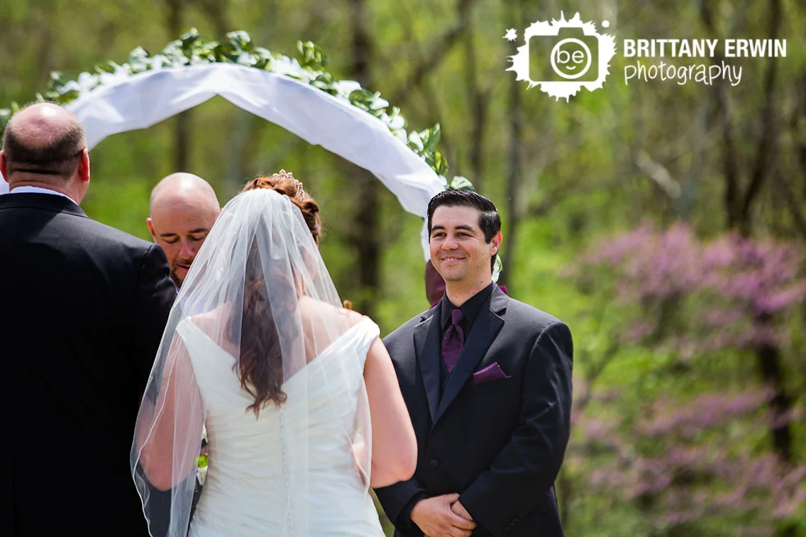 Outdoor-wedding-ceremony-photographer-groom-reaction-as-bride-walks-down-aisle.jpg