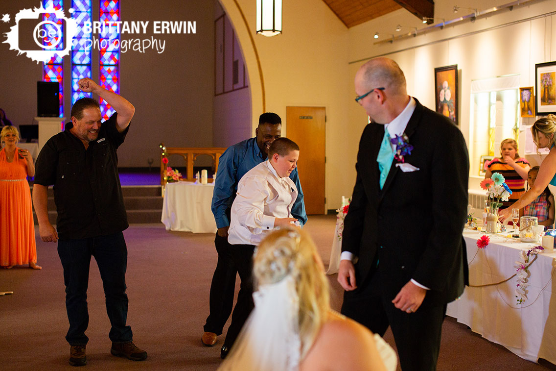 Wedding-reception-photographer-garter-toss-art-sanctuary.jpg