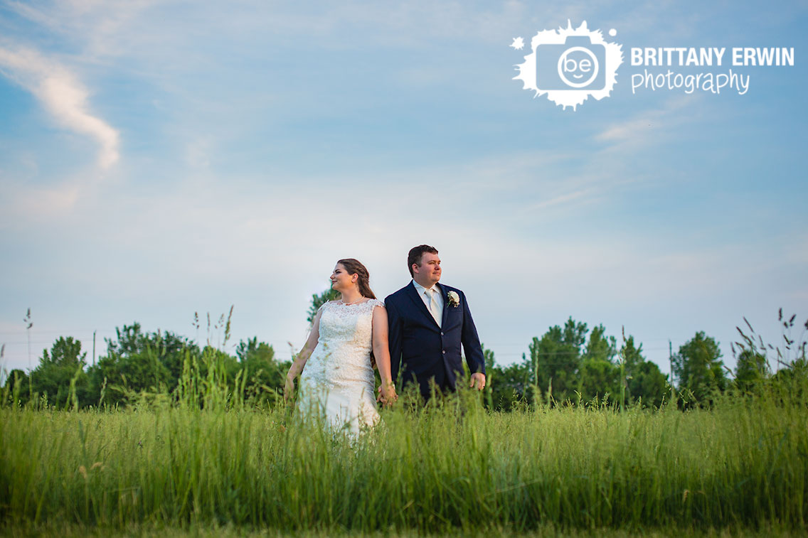 Moorseville-Indiana-wedding-photographer-sunset-skyline-couple-in-tall-grass-field.jpg