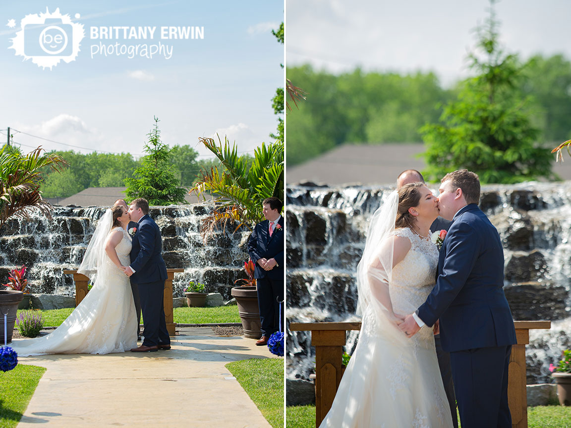 Jones-Crossing-wedding-ceremony-site-with-waterfall-backdrop-first-kiss.jpg