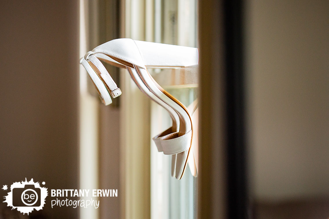 Indianapolis-wedding-photographer-shoes-in-window-hanging-on-sill.jpg