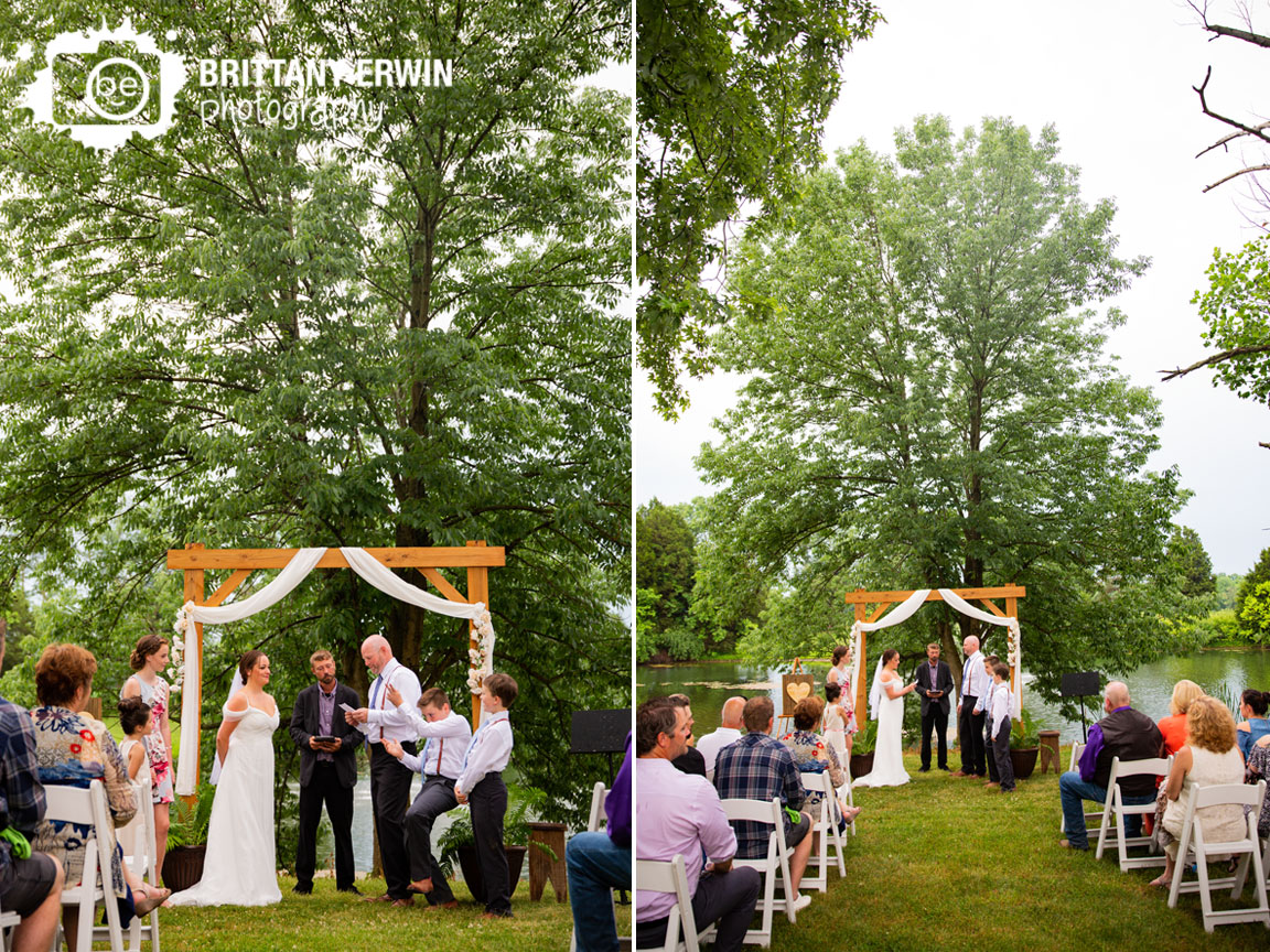 Outdoor-wedding-ceremony-wooden-arbor-couple-reading-vows.jpg