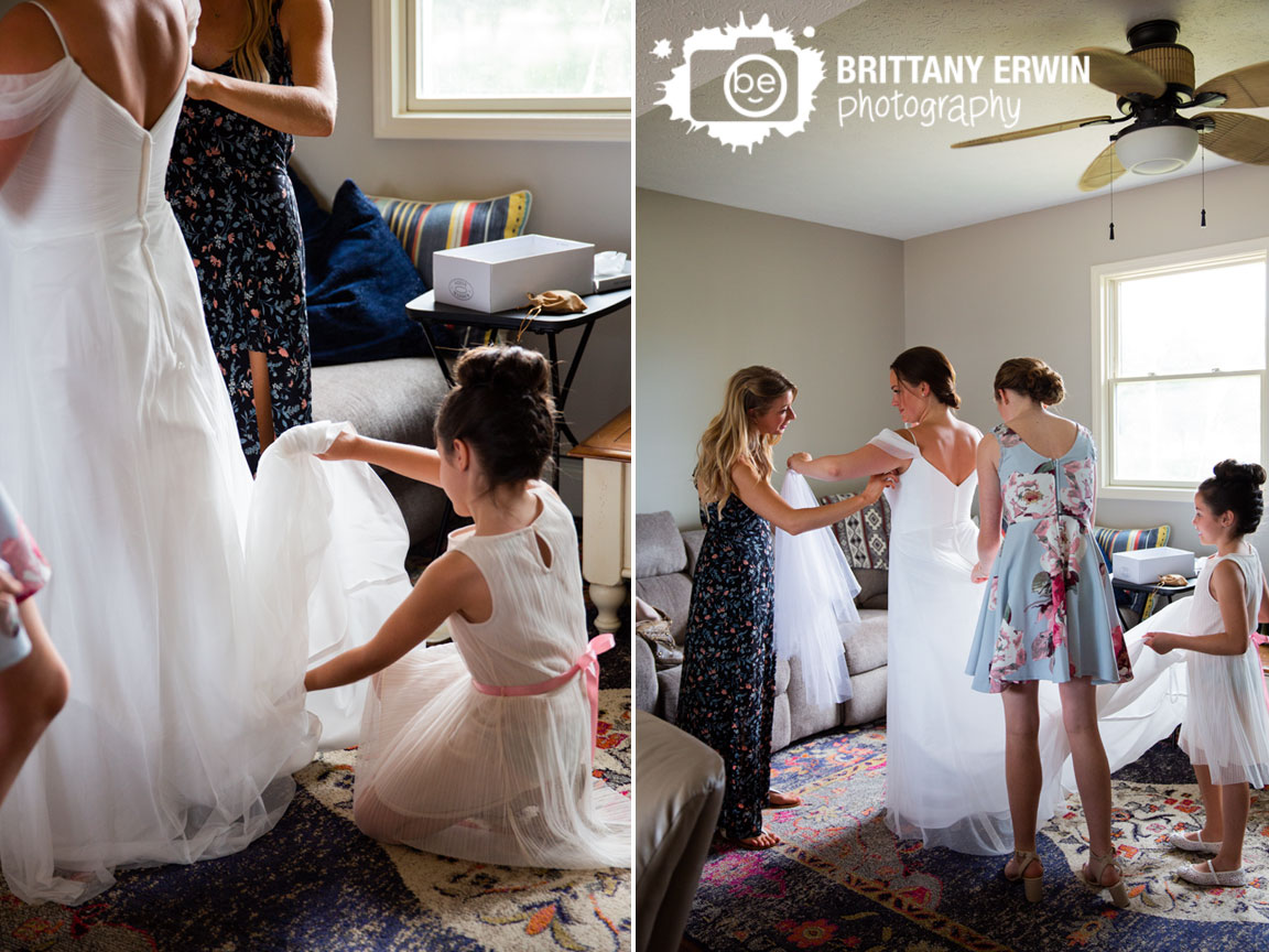 Wedding-photographer-daughter-of-bride-playing-with-dress.jpg