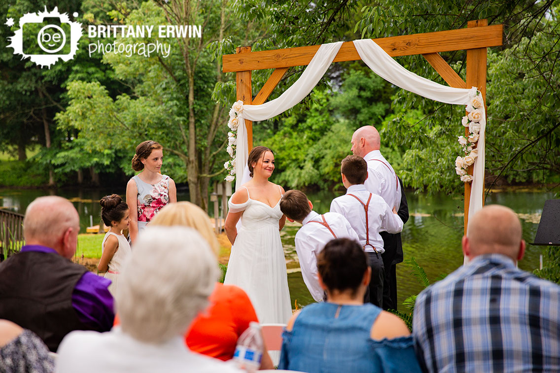 Wedding-photographer-outdoor-ceremony-bride-reaction-at-altar.jpg