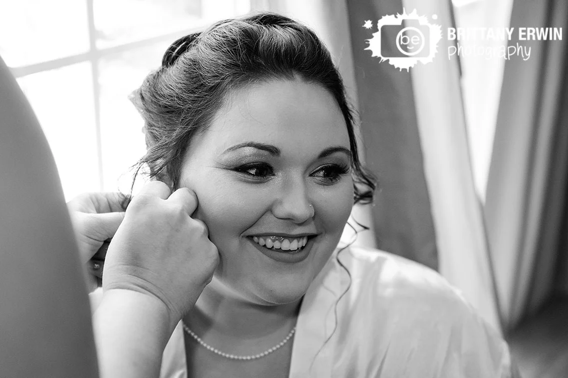 bride-putting-earrings-in-getting-ready-portrait.jpg
