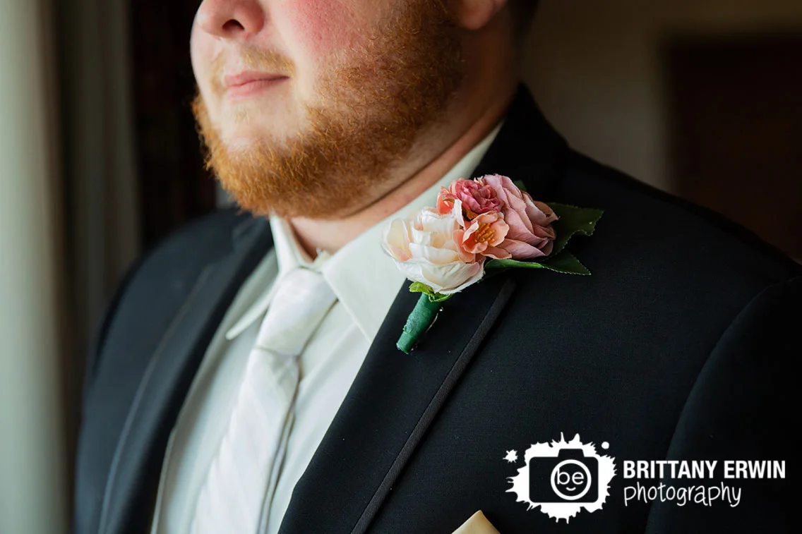 Wedding-photographer-groom-with-boutonniere-detail-portrait.jpg