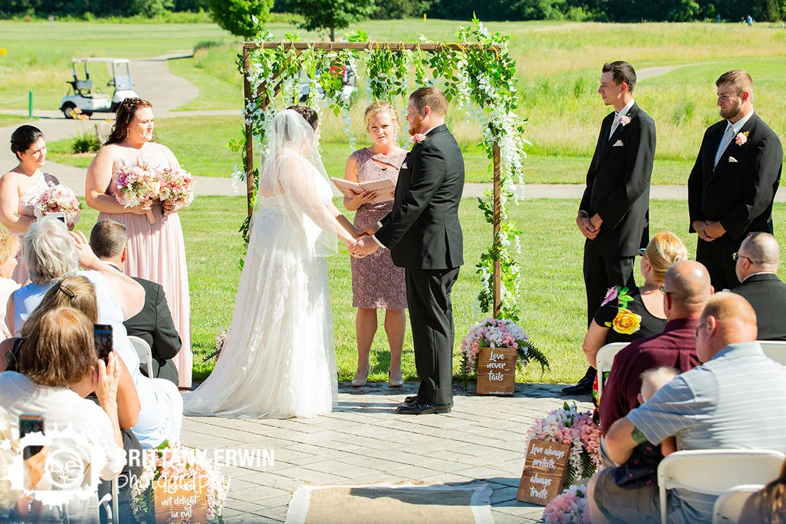 Wedding-ceremony-golf-course-arbor-flower-covered.jpg