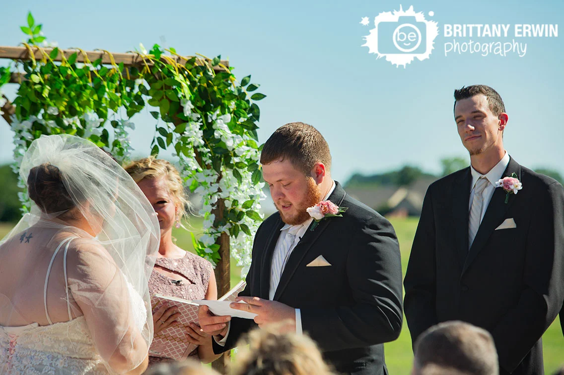 Wedding-ceremony-photographer-groom-reading-vows.jpg