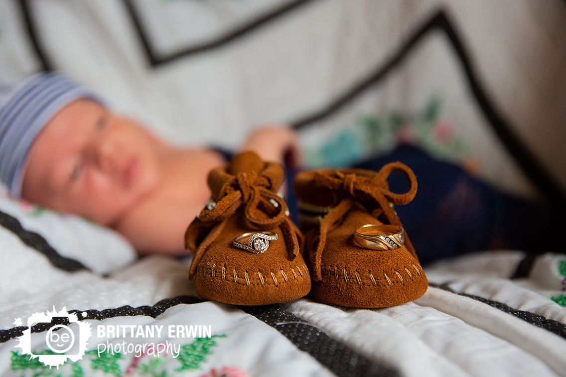 Indianapolis-newborn-detail-photographer-rings-on-tiny-shoes.jpg