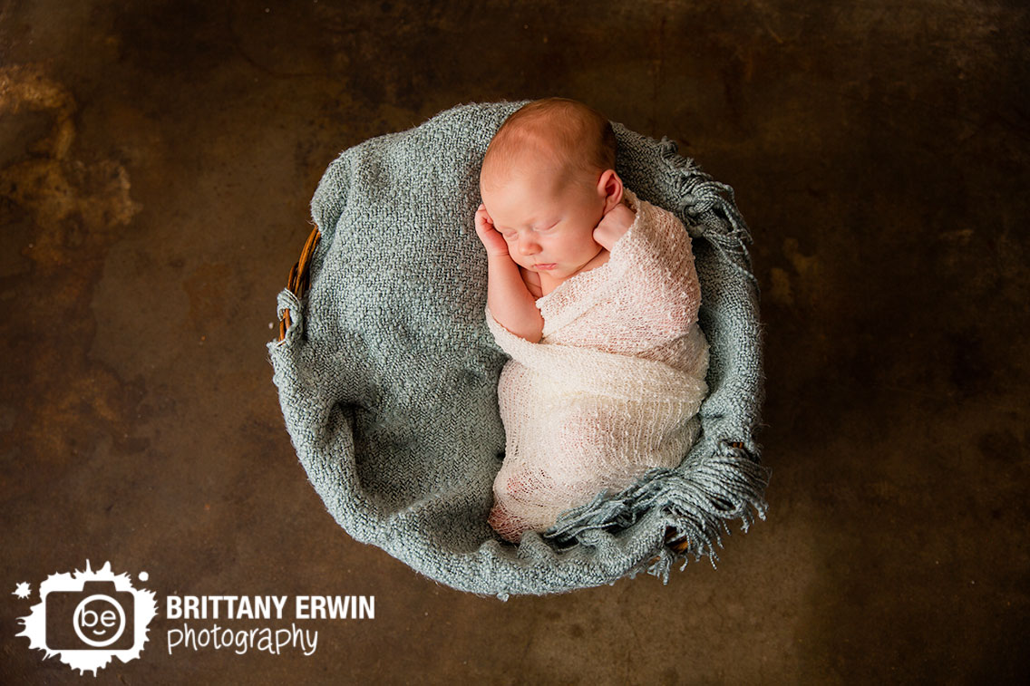 newborn-studio-photographer-baby-boy-asleep-wrapped-in-basket.jpg